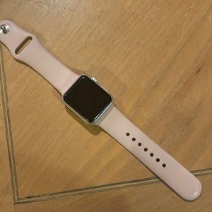 Apple Watch 38 mm with pink band. Also white band available